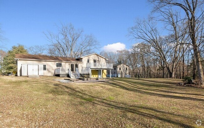 Building Photo - The generous outdoor space stretches over ... Rental