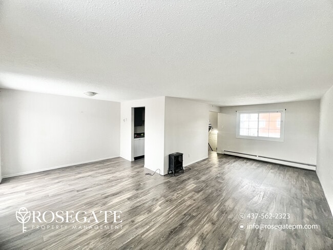 Photo - Spacious 3-Bedroom Stacked Townhouse with Garage & Backyard in Waterloo Unit 2