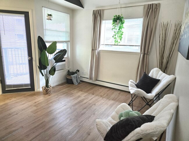 Lounge area with door to south/south-west facing deck. End unit so windows both south and west.