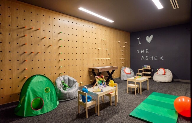 Playroom outfitted with a variety of toys and activities