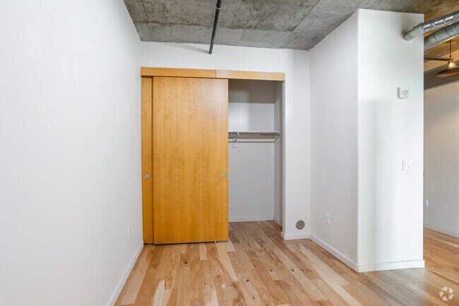 1BR, 1BA - 1,033SF - Bedroom - Waterside Lofts