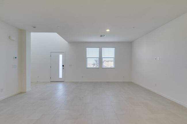 Photo - Stylish Townhome Featuring Open-Concept Living & Primary Suite Balcony