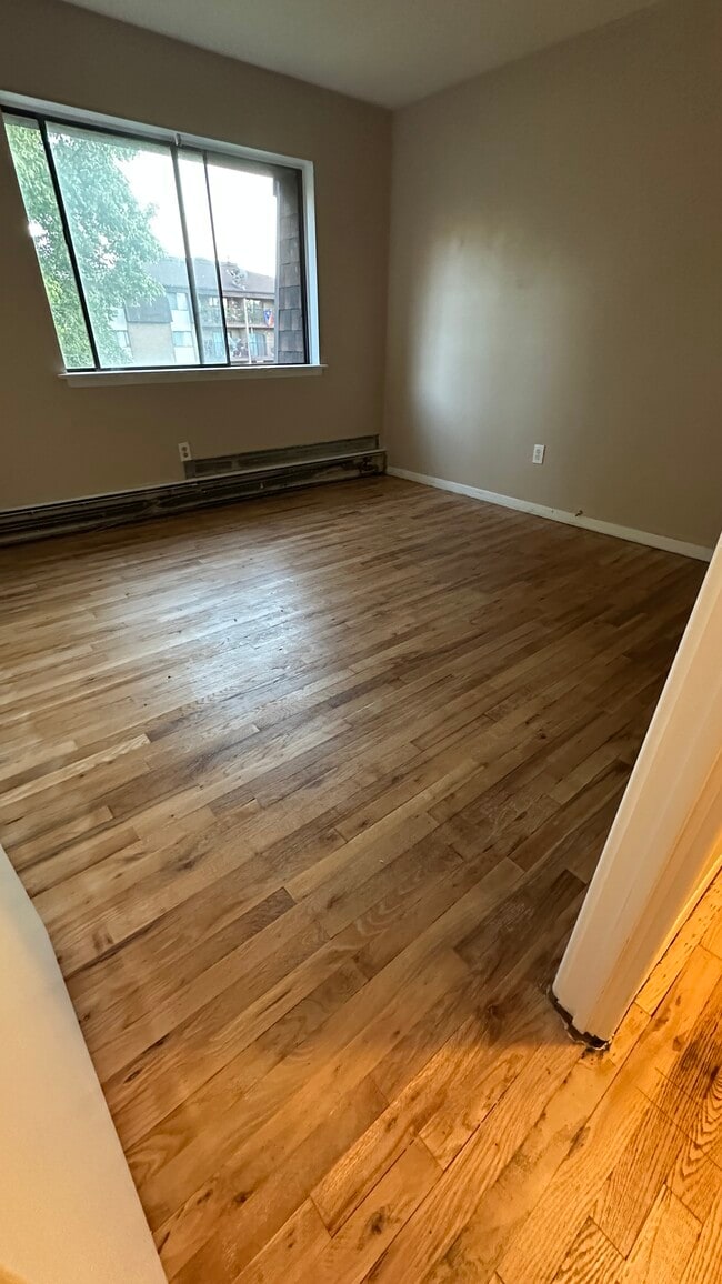 Bedroom 2 - Newly finished hardwood floor - 581 Crown St Unit #99