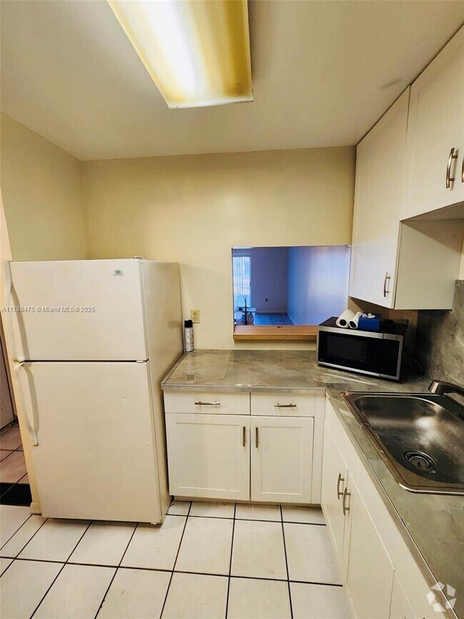 Building Photo - 11311 SW 200th St Unit 104-D Rental