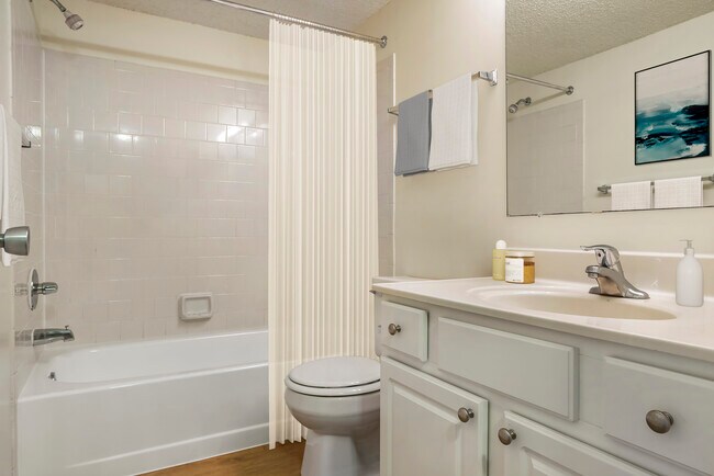 Upgraded Package I bath with white cabinetry, white countertop and hard surface flooring