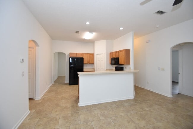 Photo - Fenced yard at this spacious 4-Bedroom Oasis with 2 Baths in Charming Palm Coast Retreat!
