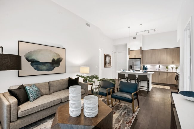 Kitchen, living, and dining areas with hard-surface vinyl plank flooring