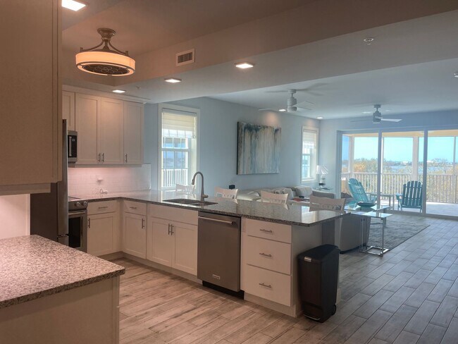 Photo - Coastal Luxury at Hidden Bay | 3BR Waterfront Condo with Bay Views