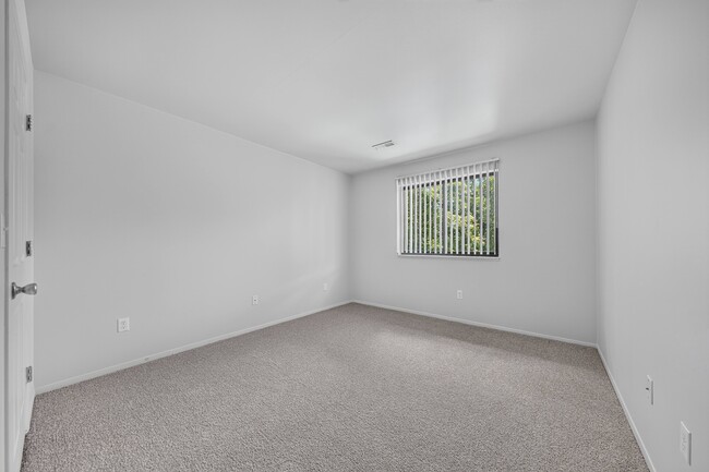Spacious bedroom at Woodland Villa Apartments in Westland, MI.