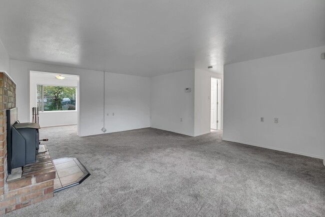 Photo - Cozy 4-Bedroom Home with Wood Stove & Large Backyard in Mountlake Terrace