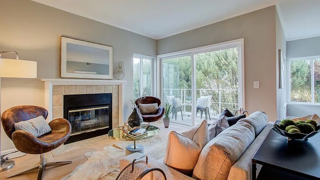 Living room with fireplace and balcony - 520 Pointe Pacific