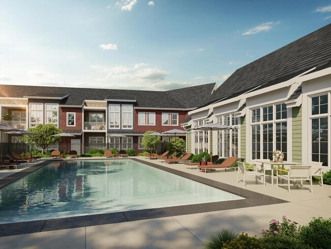 Outdoor pool and sun deck framed by tailored landscaping and comfortable seating, offering a refined setting to recharge or connect outdoors.