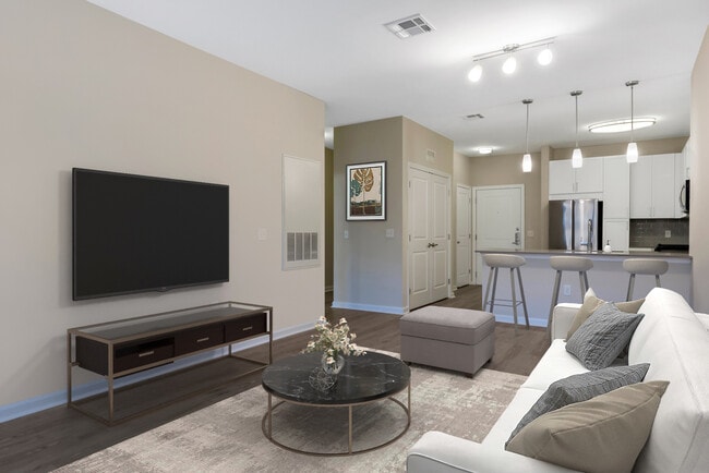 Renovated Package II kitchen, dining, and living areas with hard surface flooring