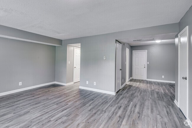 3BR, 2.5BA - 1,129SF - Living Room / Dining Area - Salem Arms