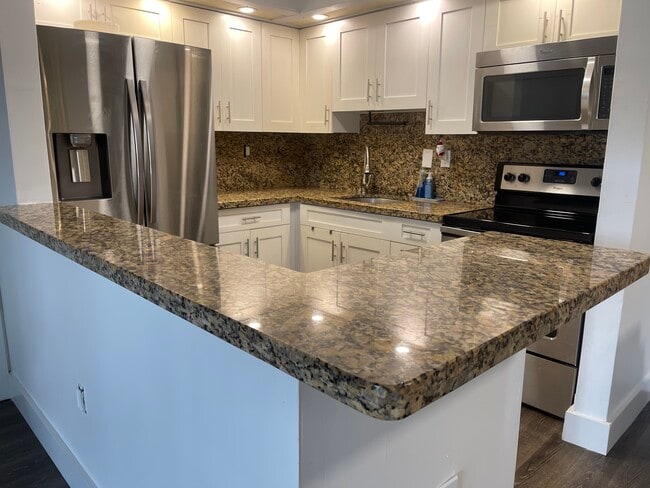 Building Photo - 19055 NW 62nd Ave Unit 104 countryside village