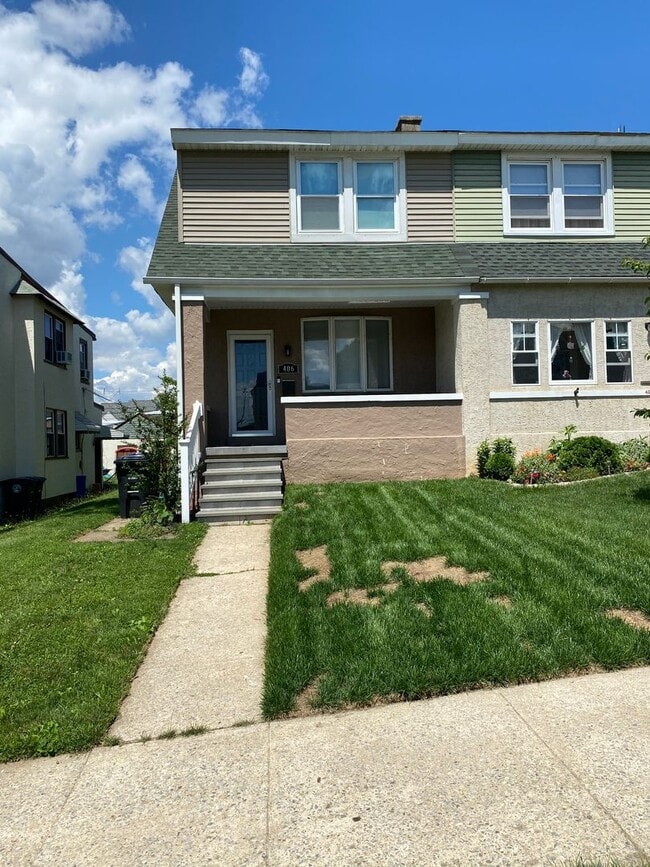 Photo - 3BR Twin Home | Hardwood Floors • Fenced Yard • Garage • W/D Included