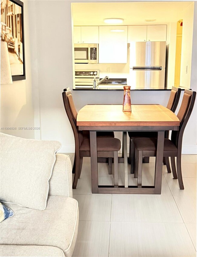 Building Photo - 6801 Harding Ave Unit 301