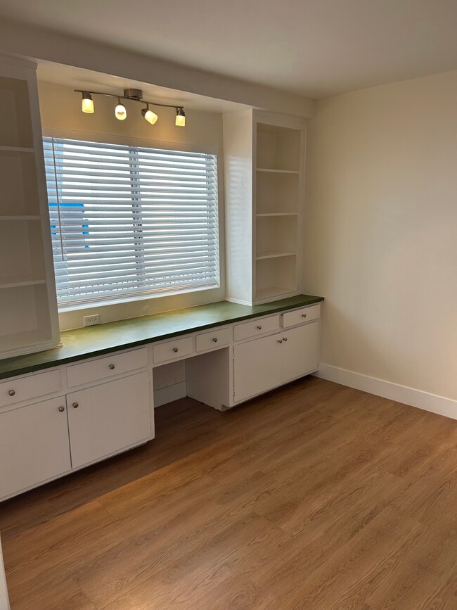 Den with large window and built in cabinets. - 1137 12th St Unit #9.    2 bedroom plus den