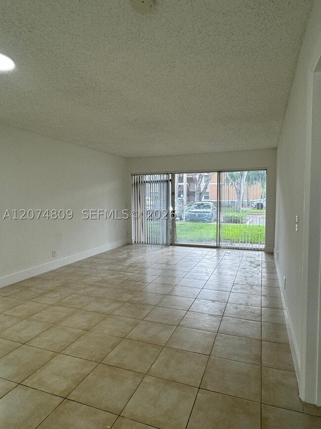 Building Photo - 8801 Wiles Rd Unit 103