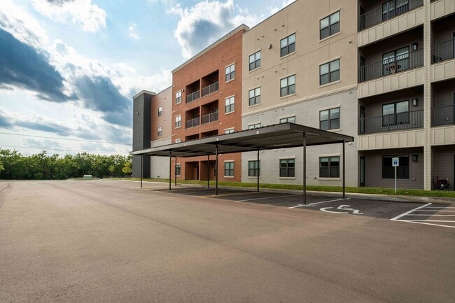 Union Mill features spacious outdoor parking and covered carports for added convenience. The modern architectural design blends comfort with practicality. Explore the possibilities for your new home today!
