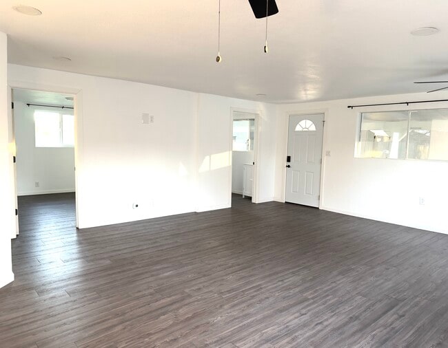 Great room with view of kitchen and hallway to br 1-2 - 16060 39th Ave