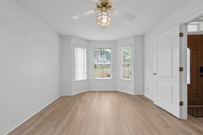 Photo - Spacious 3BR Retreat with Soaring Ceilings & Screened Porch