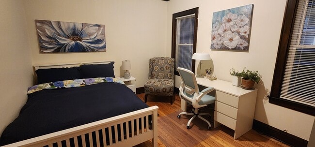 Second Bedroom with Full bed, nightstand, accent chair, desk and rolling chair, cabinet and closet. - 2018 Lake St