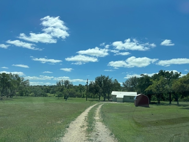 Road leading to house. There is no longer a barn. - 9900 E State Highway 71