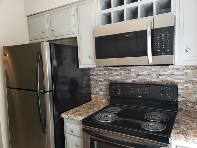 Kitchen with custom wine rack - Spanish Oaks