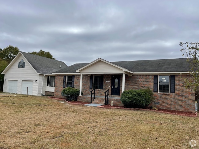 Building Photo - Spacious 4-Bedroom Home with Bonus Suite i...