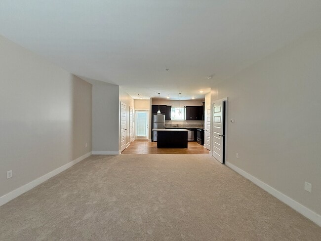 The large open floor plan flows seamlessly between the living and kitchen spaces. - 3010 Bellflower Cir