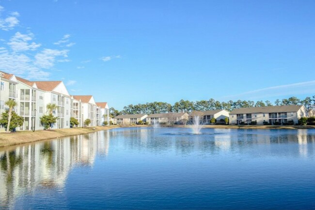 Building Photo - MOVE IN READY! 3rd Floor Condo with BEAUTIFUL Pond View! Central Location!