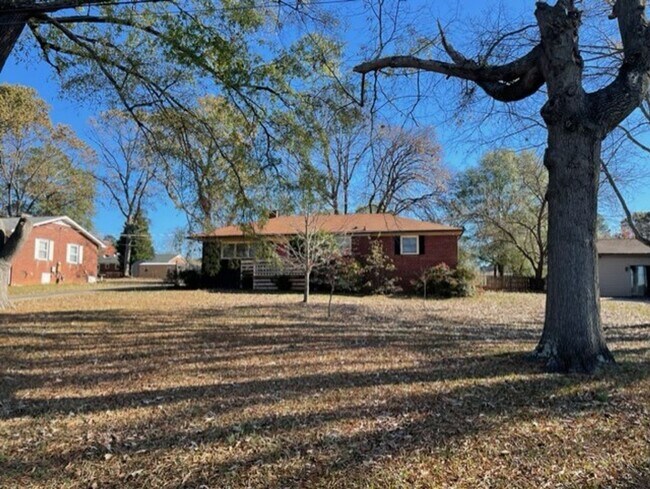 Photo - Adorable 3-bed 2-bath brick ranch, sitting on nearly a half acre lot, is located in Gastonia