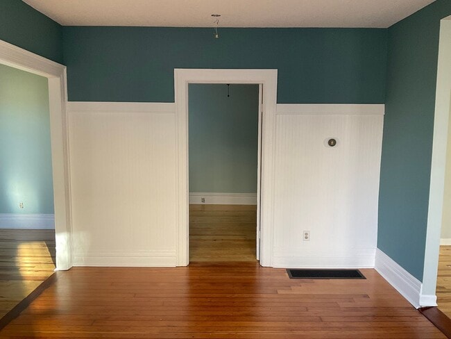 View of living room and downstairs bedroom from dining room - 3915 NE Rodney Ave
