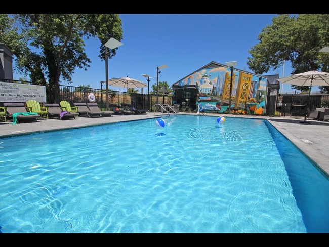 Pool Near Leasing Center - University River Village Apartments