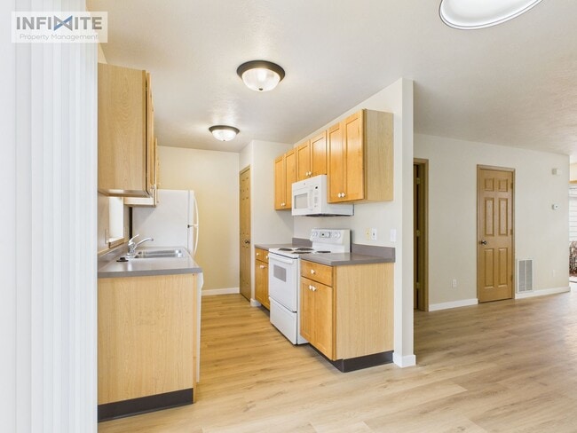 Photo - Bright & Spacious 2 Bedroom, 2 Bath Condo with Single Detached Garage – Move-In Ready!