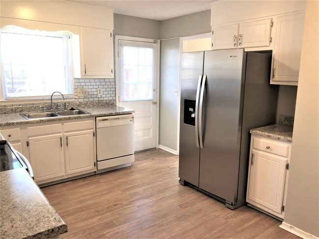 Photo - SW Large Brick Home, Updated Kitchen & Bathrooms, Wood Like Flooring, Fenced Yard!