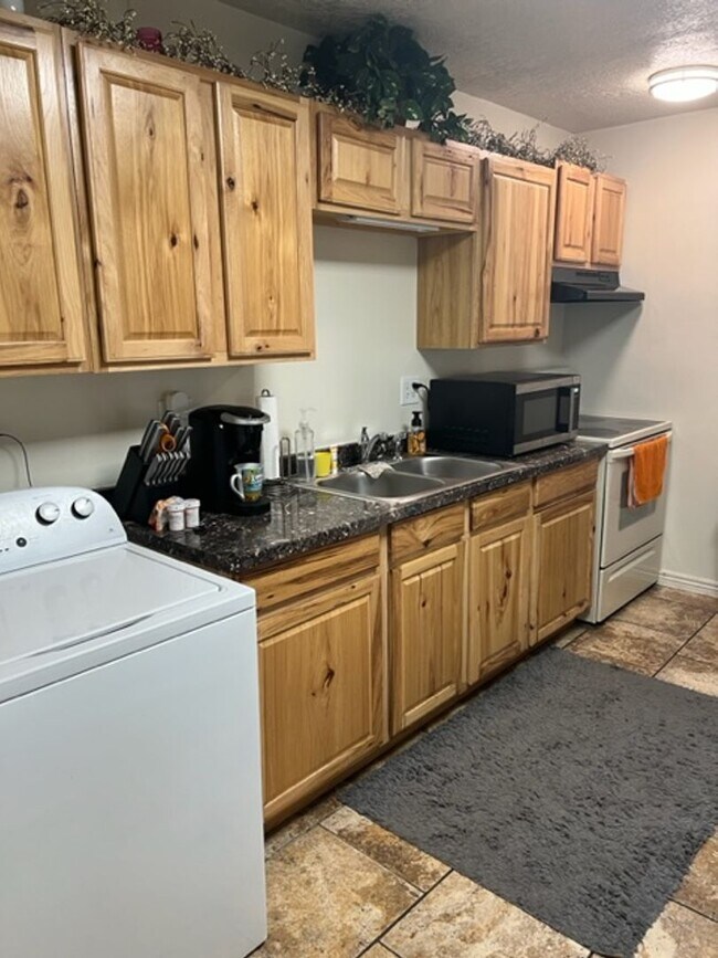 Photo - Beautiful home with garage, carport and fe...