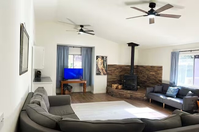 Spacious family room with indoor fireplace. - 2411 Glacier Dr