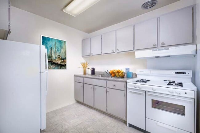 Kitchen with gas range at Kenilworth Towers Apartments in Bladensburg, MD