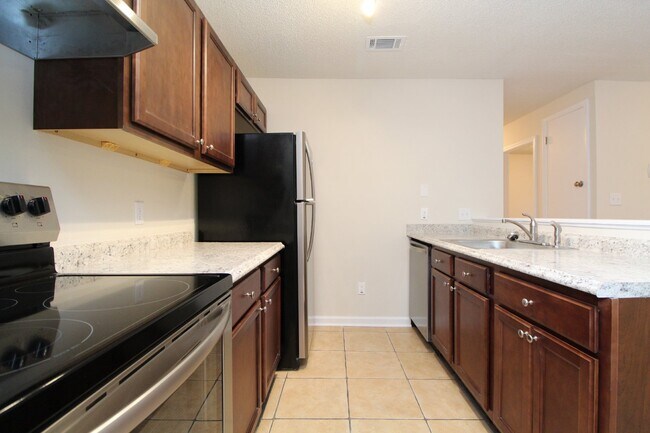 Photo - Modern 3BR/2BA Duplex with Open Layout, Fireplace, Fenced Backyard & Updated Kitchen in North Pen...
