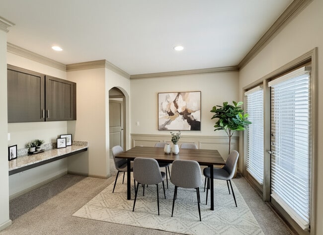Living Areas Feature Curved Archways, Crown Molding, Wainscoting, and Built-ins - Eagle's Brooke