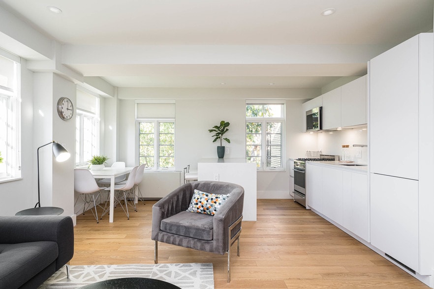 open concept living and dining room with hardwood floors