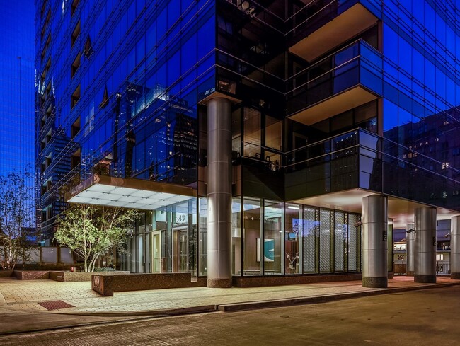 Wolf Point West Building Entry Nighttime - Wolf Point West Apartments