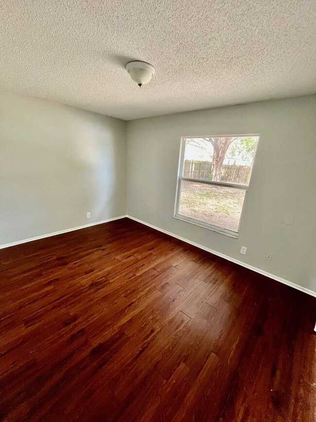 Photo - SPACIOUS 3BR/1.5BA w/Carport, Beautiful Wood Finish Flooring, Privacy Fenced Backyard! NO APP FEE!