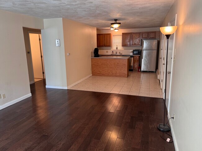Dining, counter and kitchen - 25 Arlington Rd Unit Apt 1-1