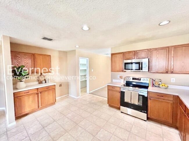 Photo - 4 Bed, 2 Bath Home with Fenced Yard & Garage / Available Now!