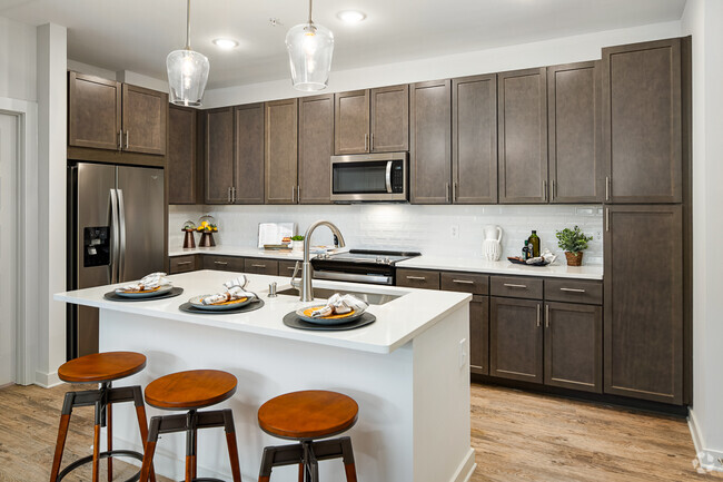 Model Kitchen with Espresso Cabinetry and Stainless Steel Appliances - Bexley Parkstone Rental