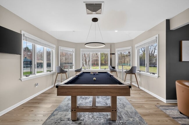 Welcome to Eagle Rock Apartments at Mohegan Lake, where modern amenities meet serene surroundings. Enjoy our stylish game room featuring natural light and beautiful views. Elevate your lifestyle today—schedule a tour!