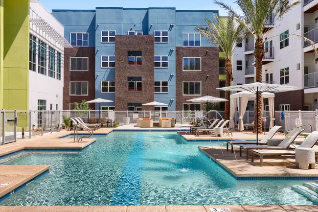The pool deck you've been dreaming about. With lounge chairs, umbrellas, a fire pit, and sparkling water features, the Garrett Uptown courtyard is your go-to retreat to beat the Arizona heat..